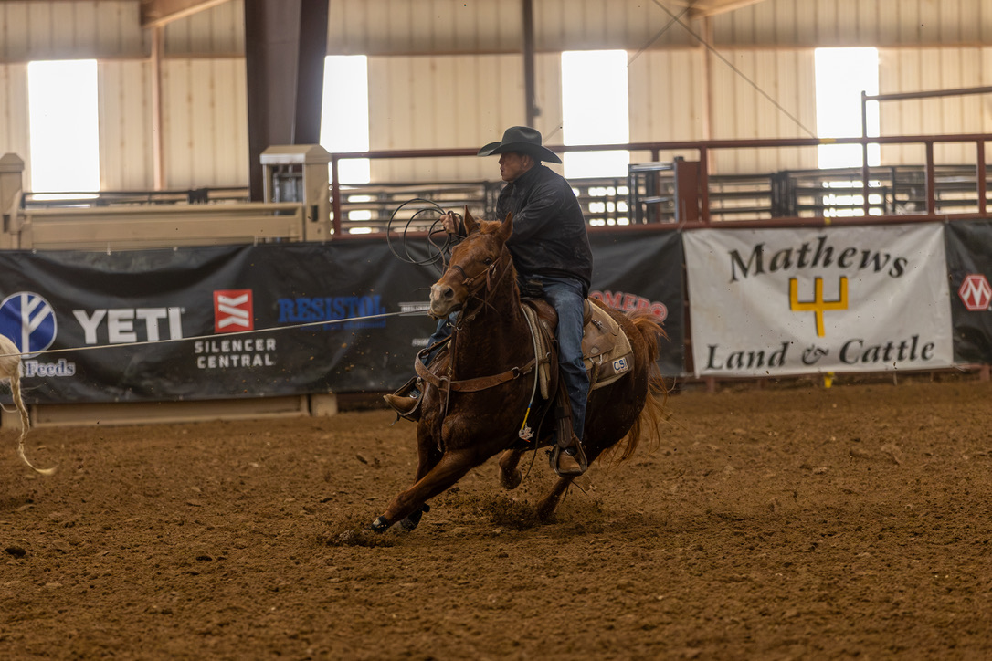 Chris Francis roping on Mathews Land & Cattle stock